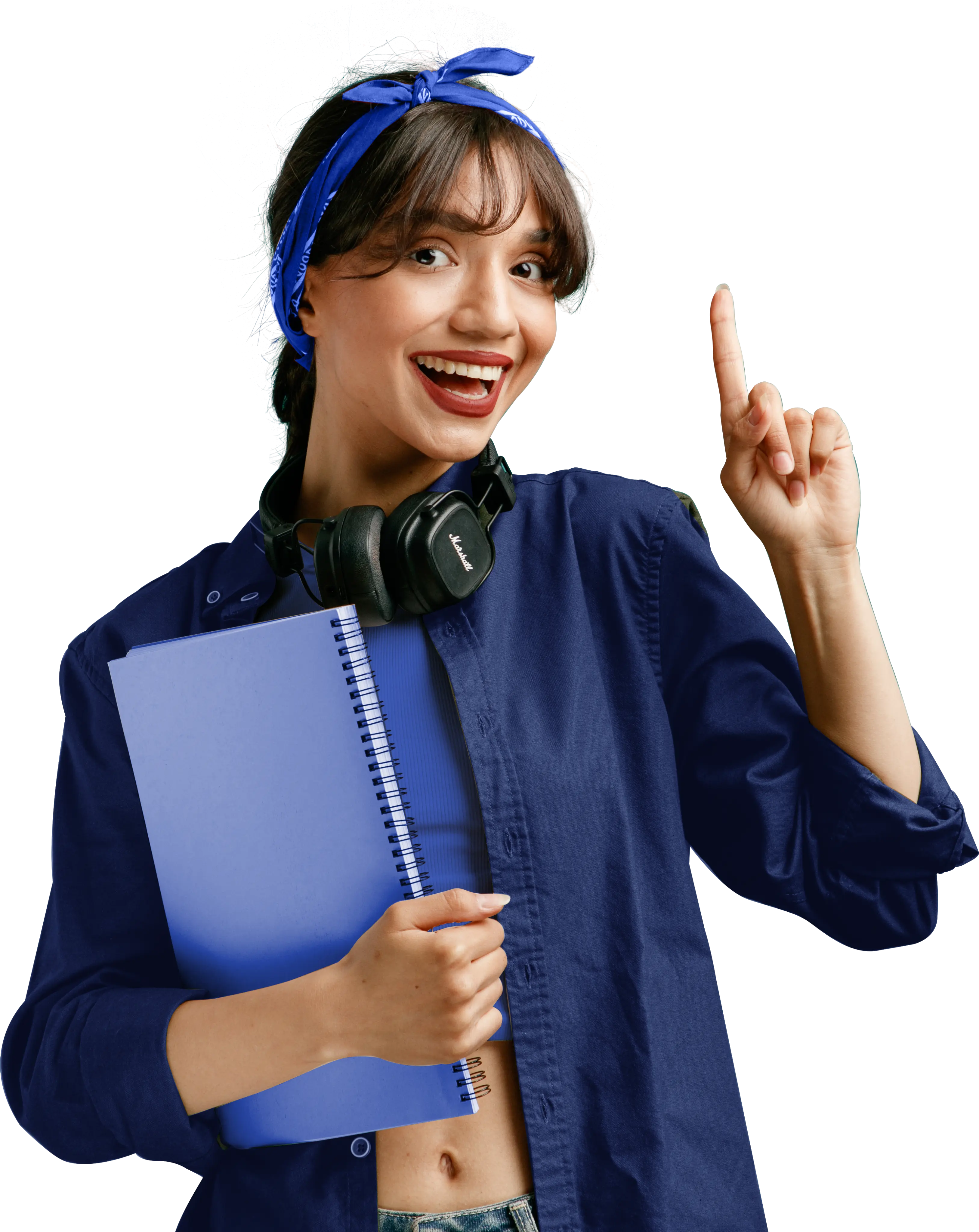 Smiling student with headphones holding a notebook and pointing up
